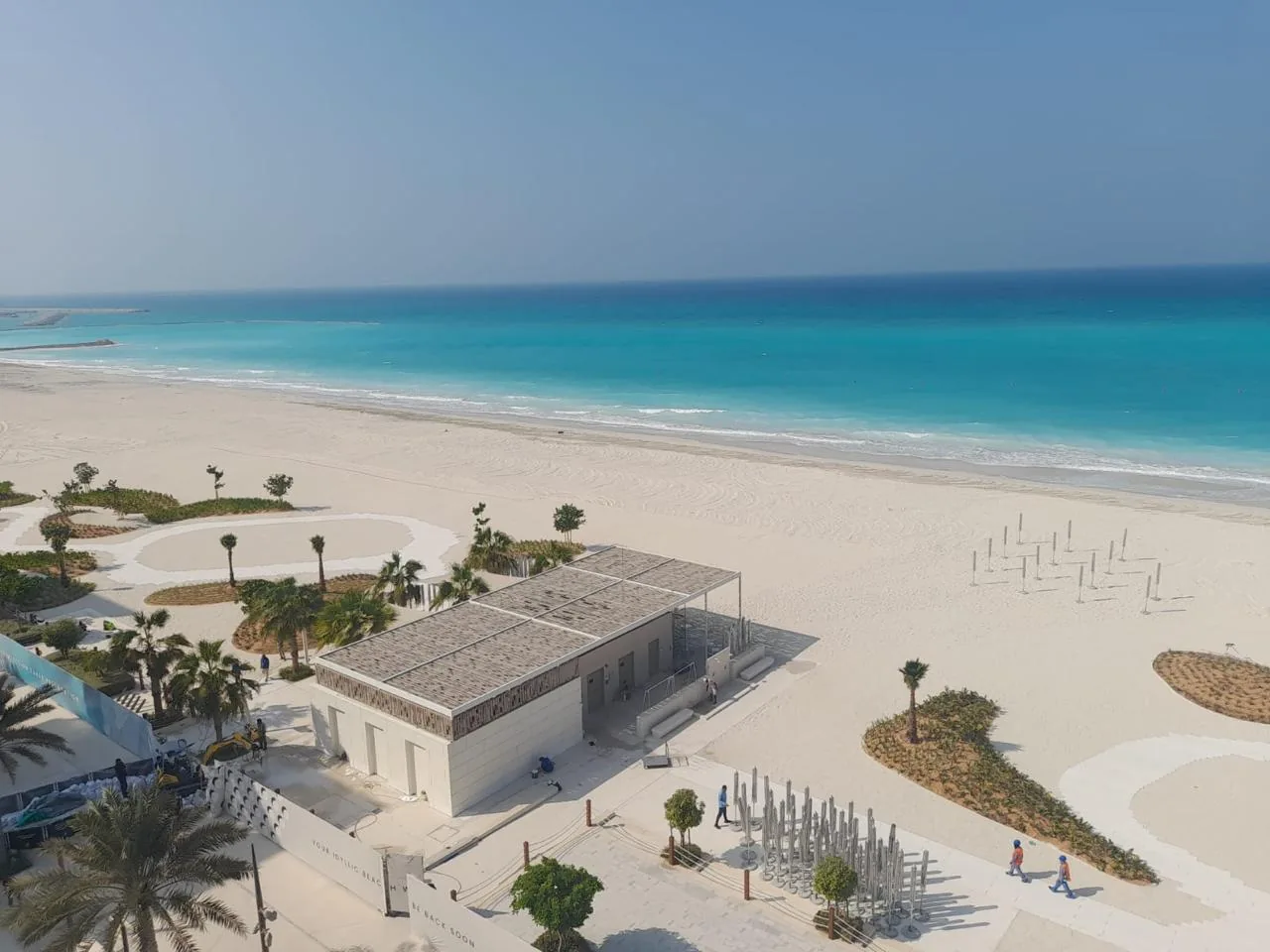 Soul Beach sand, promenade and turquoise shoreline.